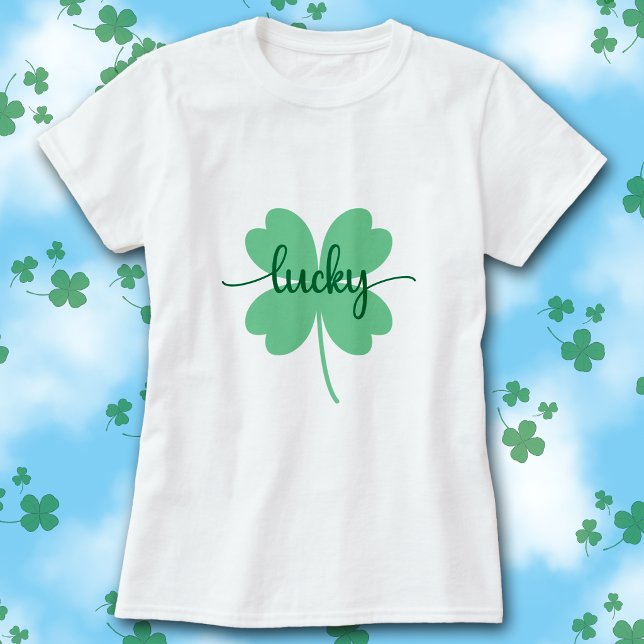 T-shirt Lucky Clover Script St. Patrick’s Day Tee        (White t-shirt with green Lucky script on a large solid green four-leaf clover graphic.)