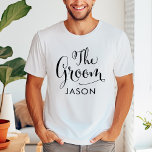T-shirt Mariage personnalisé Groom Black Script<br><div class="desc">Chemise mariage Groom présente un script de calligraphie à rotation noire moderne avec un élégant texte de prénom personnalisé que vous pouvez personnaliser. Voyez nos créations de fête nuptiale coordonnées !</div>