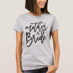 T-shirt Mother of The Bride Brush Script Modern Wedding<br><div class="desc">'Mother of the Bride' Stylish Black Brush Script Calligraphy For Bridal Party / Bachelorette Party / Wedding Shower / Bridal Shower / Wedding Party / Wedding Rehearsal T-shirt. This design features a modern and bold brushed calligraphy script on a classic vanilla white background. The base background can be changed to...</div>