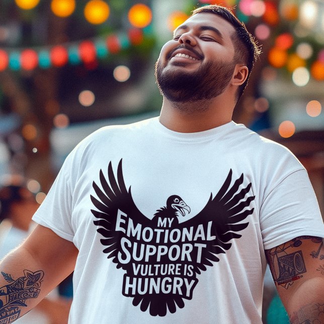 T-shirt Neurodivergence Humor Emotional Support Vulture  (Young man wearing Emotional Support Vulture neurodivergent tee enjoying a street fair festival.)