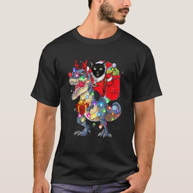 T-shirt Père Noël Chat Noir à Cheval sur un Dinosaure rex  (Devant)