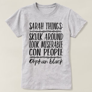 T-shirt Pièce en t noire orpheline de graphique de choses