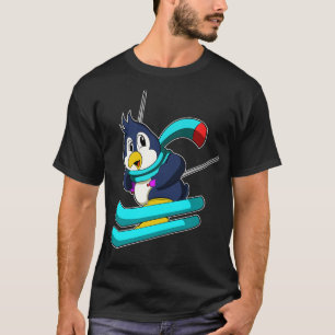 T-shirt Pingouin comme skieur avec ski