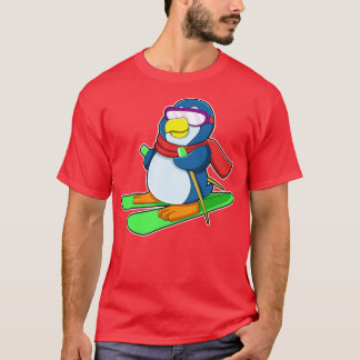 T-shirt Pingouin en ski avec lunettes de soleil à écharpe