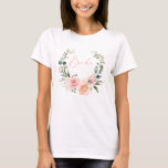 T-shirt Pink Floral Brit Script Aquarelle Wreath<br><div class="desc">Un joli t-shirt de mariée moderne et fleurie. La couronne d'aquarelle de verdure rose, pêche et eucalyptus porte le titre "Mariée" au centre, en typographie manuscrite manuscrite de script rose. Cette collection fait partie d'une collection de tee - shirts de la fête nuptiale dans ce thème de design, voir notre...</div>