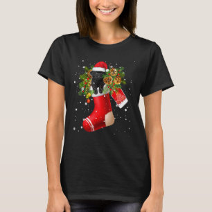 T-shirt Poodle jouet noir de Santa dans un pyjama de chaus