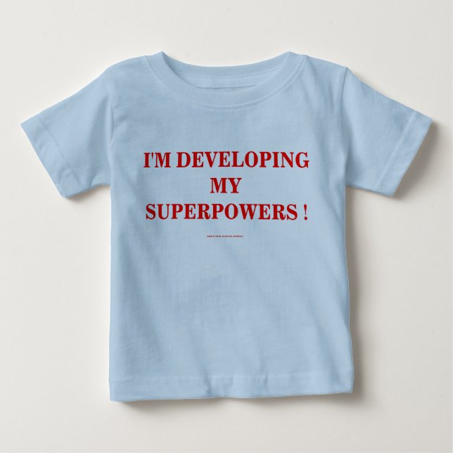 T-SHIRT POUR BÉBÉ JE DÉVELOPPE MES SUPERPUISSANCES ! (Devant)