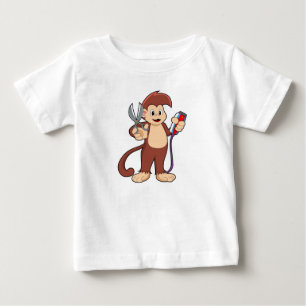 T-shirt Pour Bébé Singe comme coiffeur avec ciseaux et razor