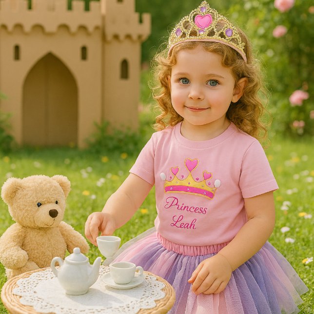 T-shirt Pour Bébé T-shirt bébé fille rose princesse mignonne (A joyful toddler girl at a tea party with a teddy bear. This t-shirt is ideal for a little princess)