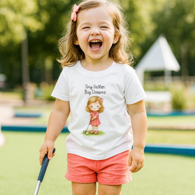 T-shirt Pour Les Tous Petits Future Golfeuse Bébé Fille ou  ( joyful little golfer.  The lifestyle mockup captures her radiant laughter, playful energy,)