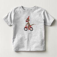 Singe de chaussette sur le vélo