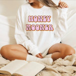 T-shirt Retro 70's Themed Honeymooner Bride<br><div class="desc">Honeymooner bride t shirt featuring a retro 70's themed font with retro pink orange coloring. This shirt makes the perfect gift for a bride-to-be, bridal shower or bachelorette weekend celebration so she can wear it on her honeymoon. Colors are editable! Click 'edit design' to create your own colors. ©Marisu Valencia...</div>
