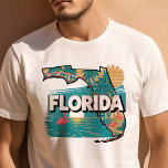 T-shirt Retro Voyage Iconique Floride Graphisme<br><div class="desc">Célébrez l'état de Sunshine avec ce T-shirt Retro Travel Iconic Florida Graphic. Doté d'un design d'inspiration vintage qui saisit la beauté vibrante et le charme unique de la Floride, cette chemise est parfaite pour les voyageurs et les résidents. Fabriqué avec des matériaux de haute qualité pour un ajustement confortable, il...</div>