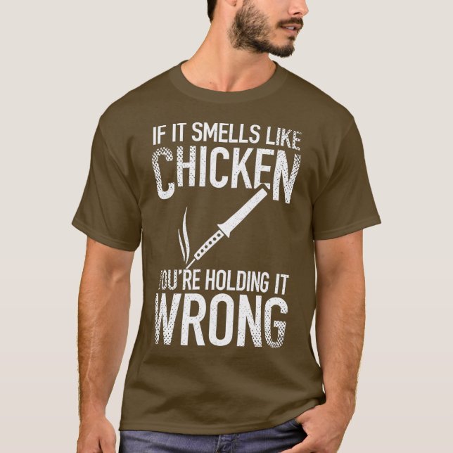 T-shirt Si ça sent le poulet, vous le tenez mal (Devant)
