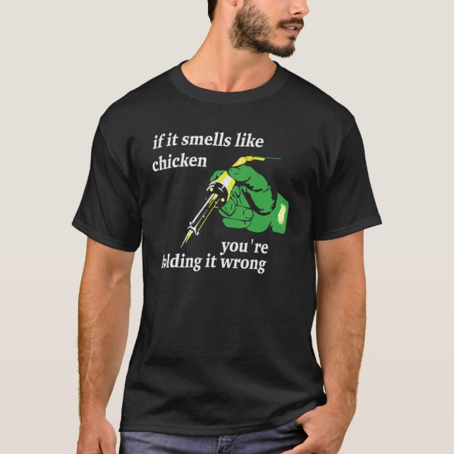 T-shirt Si ça sent le poulet, vous le tenez mal (Devant)