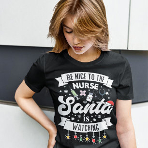 T-shirt Sois gentil avec l'infirmière Père Noël regarde No