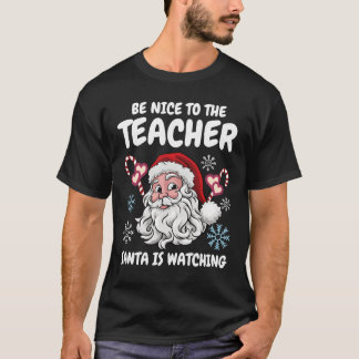 T-shirt Sois gentil avec l'instituteur Santa regarde Noël