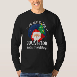 T-shirt Soyez gentil avec le conseiller Santa regarde l'éc