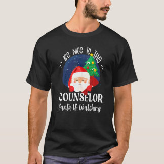 T-shirt Soyez gentil avec le conseiller Santa regarde l'éc