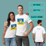T-shirt Tenez-Vous Avec L'Ukraine<br><div class="desc">Le soutien à l'Ukraine est présent dans le monde entier,  appelant à mettre fin à la violence. Express votre solidarité avec une nation qui se bat pour survivre avec ce tee.</div>