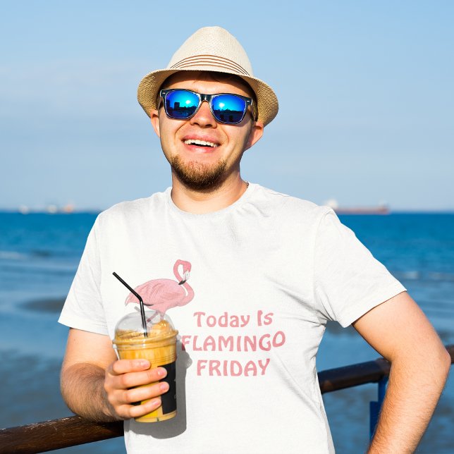 T-shirt Thème Vendredi Flamant Drôle (male model at oceanfront wearing today is flamingo friday tee shirt)