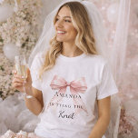 T-shirt Tying the knot pink bow pearls Bachelorette<br><div class="desc">Elevate your bridal events with this sophisticated coquette-themed party collection. Each piece showcases a high-fidelity pink bow paired with delicate pearl accents and timeless typography. This set is perfect for the modern bride wanting a cohesive look for her bachelorette trip and bridal shower.</div>