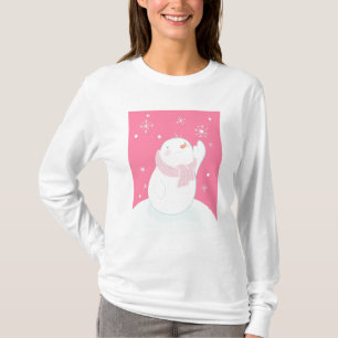 T-shirt Un bonhomme de neige atteignant pour un flocon de