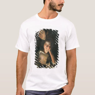 T-shirt Une fille lisant une lettre par lueur d'une bougie