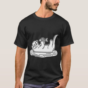 T-shirt Une loutre flottant sur le dos tout en tenant un p