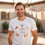 T-shirt WYNONA Orange & Turquoise Cowgirl Rodeo Daddy<br><div class="desc">Ce t-shirt présente des graphismes de cowgirl orange et turquoise mignon et les mots 'rodeo daddy' dans une combinaison de police rodéo douce. Cette chemise de papa est le cadeau parfait pour votre papa préféré, une chemise de fête de premier anniversaire, ou fonctionne comme une excellente idée de faire-part de...</div>
