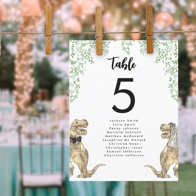 Tableau Mariage à thème Dinosaur Tableau de sièges (Dinosaur themed wedding T-Rex bride and groom with jungle foliage table seating chart)
