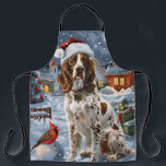 Tablier Anglais Setter Winter Wonderland Christmas Joy<br><div class="desc">Ce design festif reflète l'esprit joyeux de la période des fêtes, avec un adorable petit portant un chapeau de Père Noël. Le chien est niché dans un pays des merveilles hivernales, avec un bonhomme de neige, un sapin de Noël décoré et des cadeaux joliment emballés. Les flocons de neige tombent...</div>