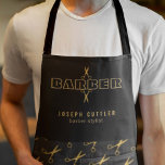 Tablier Barber name gold scissors pattern barbershop black<br><div class="desc">Personalized barber stylist apron with faux gold bold typographiy script logo and with the barber's name and title over blissors scissors patterned background.            Perfect for a professionnal men salon employee look.</div>