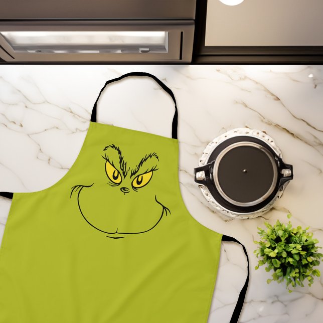 Tablier Comment le Grinch Stole Face de Noël (Apron on counter)