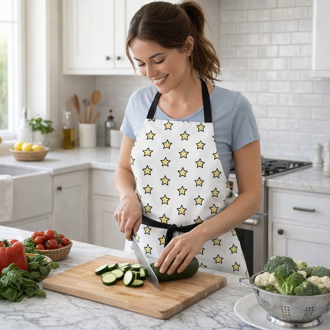 Tablier Conception graphique audacieuse de motif d'étoile  (An apron with a pattern of yellow and black stars)