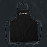 Tablier Cuisine personnalisée pour femmes à script noir et<br><div class="desc">Montrez votre style tout en cuisine avec cet Apron personnalisé de cuisine pour femmes à script noir et blanc. Le nom est dans un élégant script blanc centré sur devant un tablier noir solide. Idéal pour protéger les vêtements contre les taches et les déversements en cuisine. Disponible en différentes couleurs....</div>