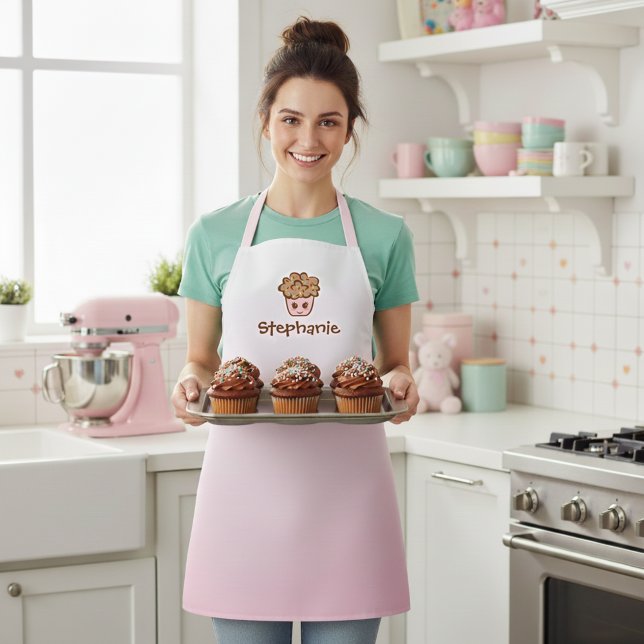 Tablier de cuisine rose avec nom Adorable Kawaii C (Cute custom name kitchen apron in pink with a kawaii cupcake illustration.)