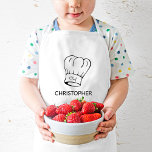 Tablier Enfant Casquette chef personnalisé<br><div class="desc">Ce tablier personnalisé s'adresse au petit chef qui aime aider en cuisine ou au barbecue grill. On y trouve l'illustration d'un casquette classique avec le mot "Chef" en écriture. Customisez-le avec le nom de l'enfant ci-dessous dans la police sans serif.</div>
