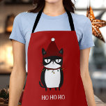 Tablier Funny Grouchy Cat Catmas Humour<br><div class="desc">Préparez-vous à cuisiner un peu de fête avec notre tablier de chat Grouchy Funny! Avec une illustration hilarante d'un chat enchevêtré dans les lumières de Noël, ce tablier est parfait pour les amoureux de les chats et ceux qui aiment bien rire dans la cuisine. Idéal pour la cuisine de vacances...</div>