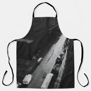 TABLIER GRAYSCALE PHOTO OF PERSON WALKING ON ROAD OUTSIDE