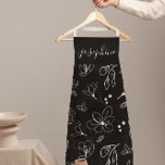 Tablier Lineart moderne noir blanc Floral personnalisé<br><div class="desc">Élevez votre style de cuisine avec ce tablier moderne Black White Floral Line Art personnalisé. Doté d'un design épuré et minimaliste de ligne florale noire et blanche, cet espace apporte élégance et sophistication à toute expérience de cuisine ou de cuisson. Customisez avec votre nom, ce qui en fait un cadeau...</div>