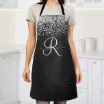 Tablier Monogramme à étincelle noire à Parties scintillant<br><div class="desc">Personnalisez facilement ce design élégant et branché d'tablier avec une jolie parties scintillant brillante en argent sur un arrière - plan métallique brossé noir.</div>