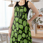 Tablier Monogramme botanique Motif de feuilles de harbe ve<br><div class="desc">Green Basil Herb Leaf Motif Nom botanique et Apron Monogram. Feuilles de basilic vert dans un motif sur un arrière - plan noir. Ajoutez votre nom et votre monogramme.</div>