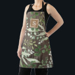 Tablier Monogramme de verdure botanique en bois rustique<br><div class="desc">Ce design d'inspiration botanique présente d'élégants feuilles d'aquarelle et des feuillages sur un arrière - plan en bois rustique. Personnalisez l'aire avec votre monogramme ou votre initiale.</div>