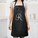 Tablier Monogramme d'étincelle à Parties scintillant noire<br><div class="desc">Personnalisez facilement ce design élégant et branché de tablier avec une jolie parties scintillant brillante noire sur un arrière - plan métallique brossé noir.</div>