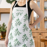 Tablier Motif Mistletoe personnalisé<br><div class="desc">Ce tablier de Noël est décoré avec de l'aquarelle et de la verdure. Facile à personnaliser. Parce que nous créons notre oeuvre,  vous ne trouverez pas cette image exacte d'autres designers. Aquarelle originale © Michele Davies.</div>