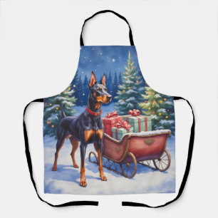 Tablier Noble Doberman gardant le traîneau de Noël en hive