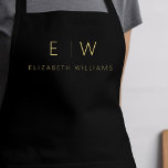 Tablier Nom de monogramme minimaliste en or noir classique<br><div class="desc">Appréciez votre expérience culinaire grâce à notre Apron de Cuisine Monogramme minimaliste Moderne Classique. Cette cuisine indispensable allie élégance intemporelle et minimalisme contemporain. Conçu avec précision, cet tablier n'est pas seulement un accessoire pratique, mais aussi un énoncé de style personnel. Le monogramme personnalisable et l'option de nom vous permettent d'imprégner...</div>