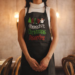Tablier Obsessionnel Trouble de Noël Drôle Vacances<br><div class="desc">OCD. Tablier de désordre de Noël obsessif en noir avec écriture verte,  rouge et blanche. Un cadeau de Noël amusant avec un joli arbre de Noël et le Père Noël pour décorer les mots. Humour de vacances présent.</div>