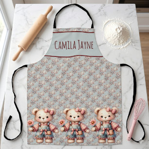 Tablier Ours en peluche pastel tenant une fleur portant un